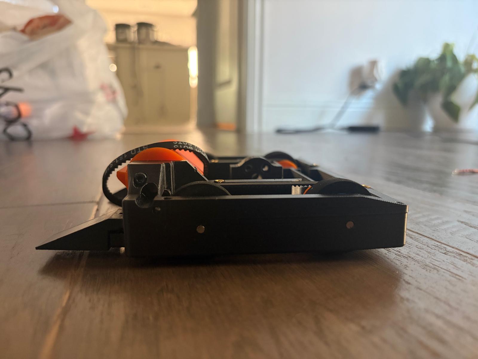 low side angle of the chassis showing the wedge and a belt